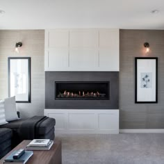 a living room with a couch, chair and fire place