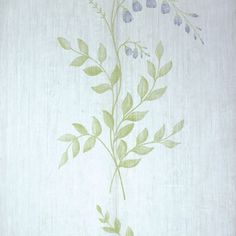 a white wall with green leaves on it