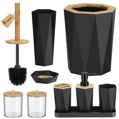 black bathroom accessories including soap dispenser, toothbrush holder and toilet brush