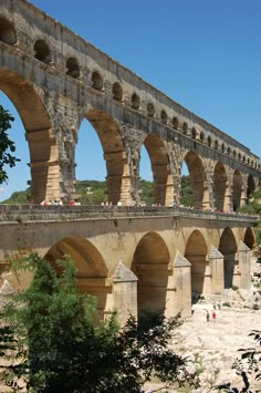 an old stone bridge with arches over it