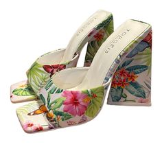 Open Toe Block High Heels Square Toe Tropical Butterfly Pattern New Without Tags/Box Heel Height: 1.25, 4.25 Shaft Height: 4.25 Slip On Formal 100% Faux Leather Upper: 100% Recycled Textile, Outsole: 70% Rubber, 30% Recycled Rubber, Lining: 100% Recycled Textile Spot Clean Open Toe Tropical Sandals For Spring, Tropical Open Toe Sandals For Spring, White Synthetic Summer Heels, Tropical Synthetic Sandals For Spring, White Heels For Vacation In Spring, White Heels For Spring Vacation, White Floral Print Party Heels, Tropical Open Toe Synthetic Sandals, Vacation Heels With Floral Print And Round Toe