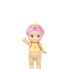 a small toy doll with a pink hat and yellow shirt on it's head