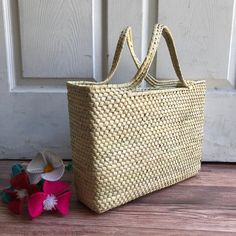 "This beautiful Palm Leaf Basket was handwoven. Ideal for shopping, picnic or the beach! MADE IN MEXICO By: Mexican Artisans For: Women Color: Basic Dimensions: 13.5 x 10.25 x 3.5 Details: - Style: Tote Bag - Material: palm leaf - Handles: 5\" Drop - Flat bottom Contact us for more details READ BEFORE PURCHASE: The picture is an ACCURATE REPRESENTATION. Colors in the pictures may vary a little by effects of light. Each product is handmade from Mexico causing differentiation and minor imperfections in each piece making them that much more unique. We strive to have consistency within our business but please be aware not all pieces are 100% alike. WE RECOMMEND READING OUR RETURN POLICY & SHIPPING POLICY BEFORE PURCHASE" Eco-friendly Rectangular Open Weave Straw Bag, Eco-friendly Square Straw Bag For Beach, Casual Rectangular Braided Crochet Bag, Rectangular Straw Bag For Summer Picnic, Casual Woven Straw Bag For Picnic, Vacation Bucket Crochet Bag With Weaving, Weaving Crochet Bucket Bag For Vacation, Casual Woven Straw Bag For Picnics, Crochet Bucket Bag With Weaving For Vacation