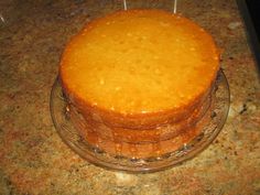 an orange cake sitting on top of a counter