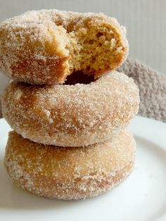 three sugared donuts stacked on top of each other