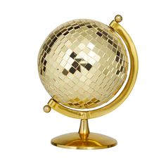 a gold and white disco ball on a stand