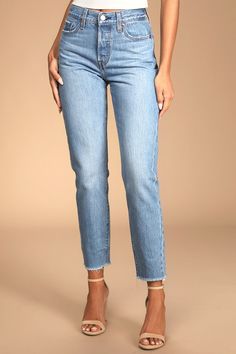 We just can't get enough of the Levi's Wedgie Straight Light Wash Distressed High-Rise Cropped Jeans! Sturdy denim (in Levi's Athens No Way wash) forms these incredibly cute and on-trend jeans with a five-pocket cut, belt loops, and high-waisted fit. Branded top button and hidden button fly top straight pant legs with frayed, cropped hems. Red logo tag and leather patch at back. Fit: This garment fits true to size. Length: Ankle length. Size 26 Waist: Fitted - very fitted at natural waist. Hip: Fitted Light Wash Jeans With Frayed Hem, Stretch Cropped Bottoms With Frayed Hem, Classic Fitted Bottoms With Frayed Hem, Fitted Slim Cotton Bottoms, Light Wash Stretch Cropped Bottoms, Classic High Rise Bottoms With Frayed Hem, Fitted Cropped Bottoms With Frayed Hem, Fitted Light Wash Pants With Five Pockets, Levi's Fitted Jeans For Spring