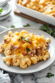 a white plate topped with macaroni and cheese