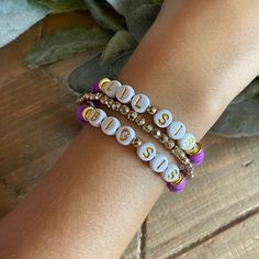 These Heishi beaded bracelets are the perfect addition to your kids jewelry collection. Perfect gift for a sibling announcement. They are soft, lightweight, stylish, and so chic. Stack with your favorite pieces or wear alone. This listing you have the option for ONE bracelet or the set with the personalization of you choice of up to 8/10 letters and or numbers. Please include personalization details in the box indicated at checkout. Details can include the following: Name, Words or Lettering Size Color / Mix of Color Anything else you feel you may need to add You can measure for your exact size simply by placing a string around the wrist and measuring against a ruler. If size is not specified at checkout, the standard size of 7 inches will be sent. Due to the nature of all the items being Purple Beaded Bracelets For Birthday, Purple Beaded Bracelet For Birthday, Adjustable Purple Letter Beads Bracelet, Adjustable Purple Beaded Bracelets With Letter Beads, Customizable Purple Name Bracelet With Adjustable Fit, Customizable Adjustable Purple Name Bracelet, Personalized Heishi Beads Stretch Bracelet For Friendship, Purple Round Bead Bracelets For Birthday, Personalized Hypoallergenic Multicolor Beaded Bracelets