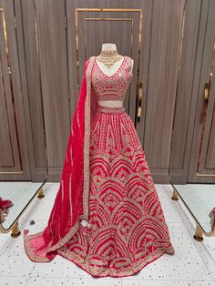 Expertly crafted for the modern bride, our Coral Pink Gotta Patti Bridal Lehenga BL-157 features a stunning coral pink color adorned with intricate gotta patti designs. Paired with a delicate organza dupatta, this lehenga exudes elegance and sophistication. Perfect for adding a touch of traditional charm to your special day. Fabric: Raw Silk! WASH CARE INSTRUCTIONS - Please Dry clean only when it is applicable! Ready to Ship! Pink Dola Silk Traditional Wear For Wedding, Pink Wedding Saree With Cutdana Work, Semi-stitched Pink Traditional Wear For Wedding, Pink Wedding Wear With Cutdana Detail, Pink Wedding Traditional Wear With Cutdana, Pink Kundan Choli For Wedding, Pink Kundan Traditional Wear For Wedding, Pink Kundan Wedding Set, Coral Pink Color