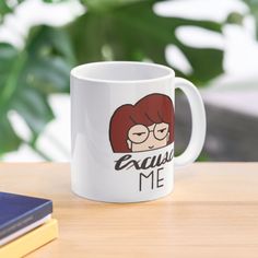 a white coffee mug with an image of a woman's face and the words equal me on it