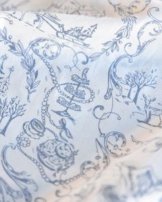 the blue and white fabric has an image of animals on it's back side