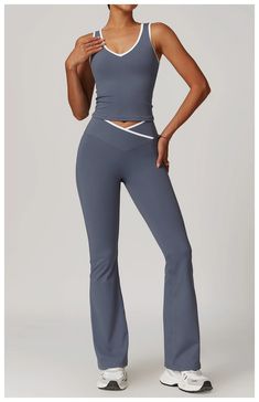 Expertly designed for maximum performance and comfort, the Aura Tank & Legging Set offers a V-front tank top with removable bra padding and V-front wide leg leggings. The two-tone design adds a touch of style while the absence of a front seam provides a smooth and seamless fit. Stay focused on your workout with this high-quality set. Product Details: Nylon/Spandex V-front tank top with removable bra padding V-front wide leg leggings Two-tone No Front Seam Imported Workout Capsule Wardrobe, Yoga Style Outfits, Crop Top Jumpsuit, Modest Activewear, Wide Leg Leggings, Pilates Clothes, Sports Wear Women, Workout Fits, Training Clothes