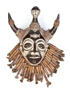 an african mask made out of cigars with horns on it's head and eyes