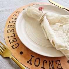 a white plate topped with a napkin and fork