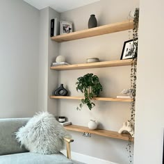 a living room filled with furniture and shelves