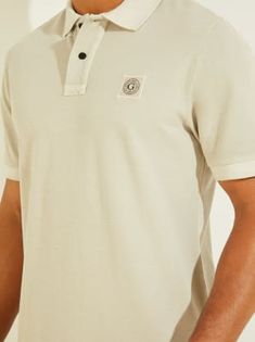 Workwear essential. Monochromatic pique polo made from a washed fabric features a folded collar, button placket, short sleeves and chest logo. 100% Organic Cotton Casual Polo Shirt With Johnny Collar, Summer Polo Shirt With Spread Collar And Button Closure, Spread Collar Polo Shirt With Button Closure For Summer, Summer Cotton Polo Shirt With Ribbed Collar, Summer Cotton Polo Shirt With Collared Neckline, Cotton Polo Shirt With Buttons, Cotton Polo Shirt With Placket For Summer, Collared Cotton T-shirt With Placket, Summer Cotton Polo Shirt With Spread Collar