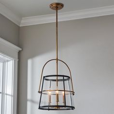 a light fixture hanging from the ceiling in a room