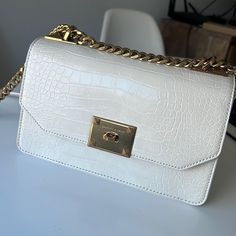 Never Worn - Push Lock Closure - Comes With Non-Adjustable Chain And Strap - Material: Embossed Faux Leather - Depth (Cm): 9 - Width (Cm): 23 - Height (Cm): 14 White Chain Bag For Formal Occasions, White Shoulder Bag With Metal Hardware For Office, Formal White Shoulder Bag With Metal Hardware, White Formal Bag With Chain Strap, White Chain Strap Bag For Office, Formal White Bag With Metal Hardware, White Shoulder Bag With Metal Hardware For Everyday, White Office Bags With Chain Strap, White Formal Bag With Metal Hardware