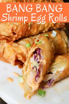 an egg roll is cut in half on a plate with the words bang bang shrimp egg rolls