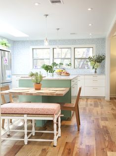 the kitchen is clean and ready to be used as a dining room or breakfast nook