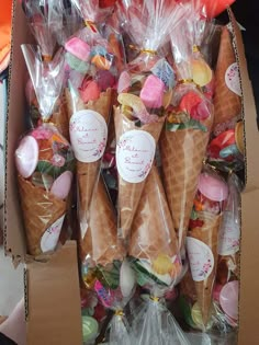 there are many ice cream cones wrapped in plastic