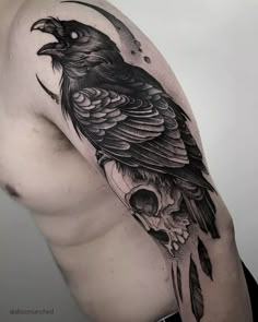 a black bird sitting on top of a man's shoulder with a skull in the foreground