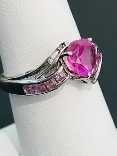 This striking heart shape pink cubic zirconia ring is handmade in sterling silver and is complete with princess cut light powder pink cubic zirconias and two natural white diamond accents. The vibrancy of the center stone will make your mouth water! The design was meticulously thought out as it includes two hearts on each side of the ring in filigree metal work. Can be sized up or down for an additional charge. Feel free to contact us with any questions you may have. Dragon Ring, Vintage Diamond Rings, Ring With Diamond, Cubic Zirconia Rings, Two Hearts, Metal Work, Powder Pink, Vintage Diamond, Princess Cut