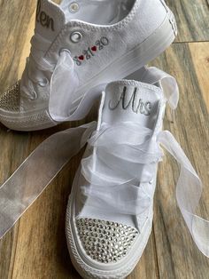 Embroidered Converse with Bling on the toes and ribbon laces!I will use white ribbon laces unless you request a different color, Message me your requests as all colors are not always available (some other colors are available)Getting Married?  What a great idea. This listing is for Mrs on the tongue and with date on the side !  I will use the font shown unless you message me with your requests!You choose your thread colors, I have hundreds of colors, just let me knowOther options available in my Low-top Wedding Shoes With White Laces, Low-top Lace Wedding Shoes For Bride, Low-top Wedding Shoes With White Laces For Bridal Shower, White Sneakers With Laces For Bridal Shower, Lace-up Wedding Shoes With Laces, White Lace-up Wedding Shoes For Bridal Shower, Round Toe Wedding Shoes With Laces For Bridal Shower, Lace-up Wedding Shoes With White Laces, White Lace-up Wedding Shoes With White Laces