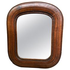 a wooden frame mirror on a white background