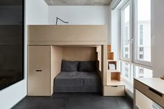 a loft bed is built into the side of a wall