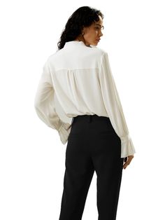 The palace pleat design on the cuffs adds an extra element of sophistication, creating an atmosphere of refined elegance. Whether it's for work or casual outings, this blouse is versatile and suitable for any occasion. 23MM Ghost Crepe V-neck Neckline ribbon Pleated cuffs Suitable for casual work and vacations Elegant V-neck Blouse For Office, Elegant V-neck Blouse For Fall, Elegant Silk Top For Business, Feminine Solid Color Blouse For Workwear, Elegant Semi-formal Solid Color Tops, Elegant Solid Top For Semi-formal Occasions, Elegant Semi-formal Solid Top, Elegant Solid Semi-formal Top, Solid Color Blouse With Button Cuffs For Business Casual