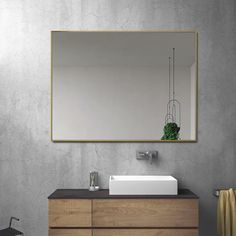 a bathroom with a sink and mirror on the wall