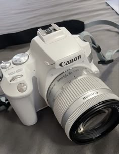 a white camera sitting on top of a table