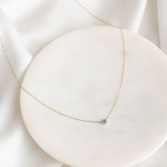 Our Amalie Necklace features an elegant emerald pendant on a 14k gold chain—a timeless addition to any jewelry collection! 


Lab grown emerald pendant measures 3mm in diameter

Necklace has an adjustable length and can be worn at 16", 17" and 18" Elegant 14k Gold Emerald Necklace With Delicate Chain, Emerald Pendant Necklace With Adjustable Chain For May Birthstone, Fine Jewelry: Yellow Gold Emerald Necklace With Delicate Chain, Elegant Emerald Necklace With Cable Chain As Gift, May Birthstone Emerald Pendant Necklace With Adjustable Chain, Elegant Emerald Necklace With Cable Chain, Minimalist Emerald Necklace For Formal Occasions, Minimalist Formal Emerald Necklace, Formal Minimalist Emerald Necklace