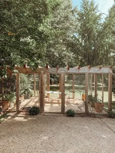 a wooden structure with glass doors in the middle