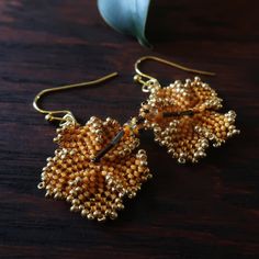 Heart in Hawaii Beaded Hibiscus Earrings - Mango and Gold Traditional Gold Flower Earrings, Gold Beaded Flower-shaped Jewelry, Gold Beaded Flower Shaped Jewelry, Gold Flower-shaped Beaded Jewelry, Gold Dangle Beaded Earrings With Bead Caps, Gold Tiny Beads Drop Earrings, Traditional Gold Flower Earrings With Ear Wire, Gold Drop Earrings With Tiny Beads, Gold Flower-shaped Jewelry With Gold Beads