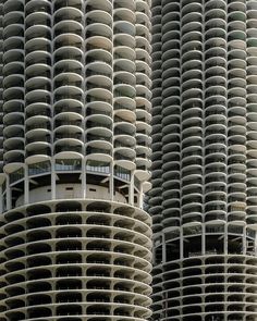 two very tall buildings with circular balconies