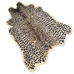 an animal print rug with black and white spots on the bottom, in front of a white background