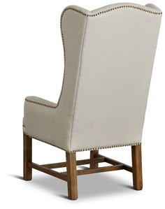 an upholstered chair with nail - tipped trimmings