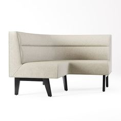 the corner sofa is made out of fabric and has a wooden leg, which matches with the rest of the couch