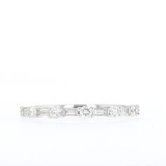 Diamond Baguette and Round Band Metal: 14K White GoldDiamonds: Six 3x1.25mm SI2-SI3, GHI Step Baguette Genuine Diamonds, Seven 2.2mm SI2-SI3, G-H Round Full Cut Genuine Diamonds Diamond White Eternity Band With Baguette Diamonds, Elegant Baguette Cut Channel Set Eternity Band, Elegant Baguette Cut Eternity Band, White Gold Eternity Band With Baguette Diamonds, Round Eternity Band With Baguette Diamonds, Cubic Zirconia Eternity Band With Baguette Diamonds, Elegant Eternity Band With Baguette Diamonds In Cubic Zirconia, Elegant Diamond White Eternity Band With Baguette Diamonds, Elegant Half Eternity Band With Baguette Cut