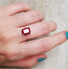 "-------------------------------------------------------- THE PRODUCT This Raw Emerald Cut Solitaire Ring is made from a beautiful ruby. It is red in color that will truly mesmerize anyone who sees it. With its size, 8x10 mm, and thick depth it is a ring that will be noticed by everyone and you'll never want to take it off. We are able to sell this amazing piece at a very affordable price by working with small and local mining families instead of corporations and foregoing official Gem certifica Ruby Rectangle Ring, Ruby Square Ring, Red Emerald Cut Birthstone Ring, Emerald Cut Red Birthstone Ring, Emerald Cut Ruby Ring, Ruby Ring With Rectangular Stone For Anniversary, Red Emerald Cut Birthstone Promise Ring, Square Cut Ruby Ring In Red, Square Cut Ruby Ring