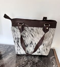 -%100 Cowhide bag.30.cm.25.cm cm.1.ft.x.0.9.ft -Natural color.brown. White .grey -Completely natural, real and odorless. -Express shipping. Thanks for visiting our shop. Hope we can help you find perfect decoration. All of our sheepskins are real, natural, odorless and soft. They are all selected and processed carefully. Brown Satchel For Travel, Brown Bag With Top Carry Handle For Gift, Brown Bag With Top Carry Handle As Gift, Brown Double Handle Shoulder Bag Gift, Brown Double Handle Gift Bag, Gift Shoulder Tote Bag With Leather Handles, Handheld Brown Shoulder Gift Bag, Gift Shoulder Bag With Double Leather Handles, Large Tote Purse