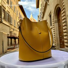 "This bag has been made of the best genuine leather by local master crafters of Florence in Italy, designed for women who only accept premium Italian quality and luxury leather bags and modern Italian fashion. . Size: Width: 27 cm / 10.75 inches Height: 19 cm / 7.50 inches Depth: 9 cm / 3.50 inches . The story of this bag : Once upon a time, in the charming city of Florence, Italy, renowned for its exquisite artistry and craftsmanship, there existed a small workshop tucked away in a cobblestone alley. This was the home of a gifted artisan named Alessio, whose passion for creating beauty out of leather was unparalleled. Alessio specialized in handcrafted leather goods, and his most prized creations were the leather clutch bags that exuded elegance and sophistication. The timeless charm of h Elegant Leather-lined Bucket Shoulder Bag, Elegant Bucket Shape Shoulder Bag With Leather Lining, Elegant Bucket Shape Bag With Leather Lining, Elegant Bucket Shape Shoulder Bag For Travel, Elegant Soft Leather Bucket Hobo Bag, Formal Leather Bucket Bag, Classic Leather Bucket Bag, Formal Bags With Leather Lining And Bucket Shape, Large Capacity Leather Hobo Bag For Formal Occasions