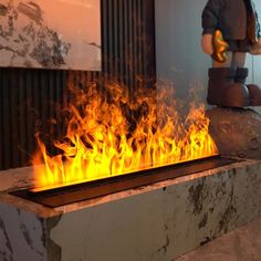 a fire is burning in the middle of a room next to a wall with a lego figure on it