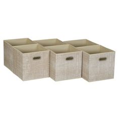 four beige storage bins with handles on each side