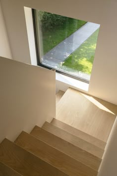 the stairs lead up to an open window