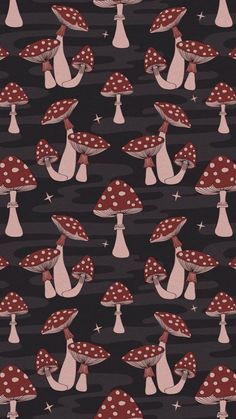 a black background with red and white mushrooms on it