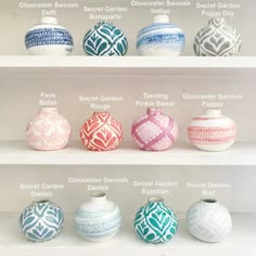 several different vases on shelves with names